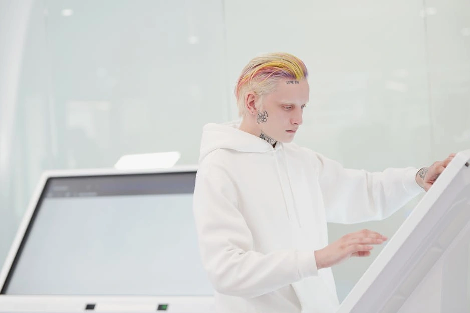 A professional reviewing complex data on a transparent digital screen in a modern office.